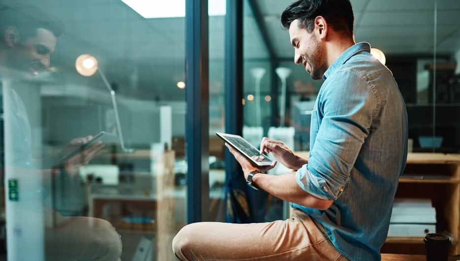 Business man, tablet and smile in office for planning, data upda